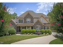 Elegant two-story home with stone accents and landscaping at 2933 Elmfield St, Raleigh, NC 27614