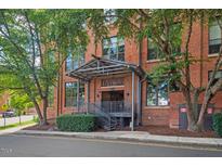 Brick building with covered entrance and landscaping at 500 N Duke St # 53-307, Durham, NC 27701