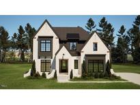 Two-story modern home with a stylish facade at 3709 Joyful Creek Trl, Zebulon, NC 27597