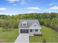 New construction home with stone and siding at 20 Morning Dew Way, Spring Hope, NC 27882
