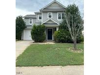 Two-story home with gray siding and landscaping at 506 Averasboro Dr, Clayton, NC 27520