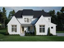 Stunning two-story home with white brick exterior at 5628 Bella Terra Ct, Wake Forest, NC 27587