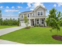 Two story home with attached garage and landscaped yard at 8820 Melvin St # 16, Willow Springs, NC 27592