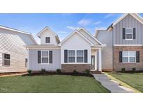 Modern two-story home with gray and white siding at 795 Washington St, Fuquay Varina, NC 27526