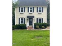 Two-story house with vinyl siding, a covered entry, and a well-maintained lawn at 2638 Davis St, Raleigh, NC 27608
