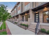 Modern townhome exteriors with brick, wood, and metal accents at 779 Willard St, Durham, NC 27701