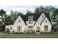 Two-story craftsman style home with a white brick facade at 37 Green Turtle Ln, Pittsboro, NC 27312