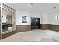 Modern building entrance with stylish double doors at 222 Glenwood Ave # 307, Raleigh, NC 27603