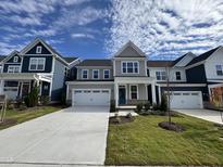 Two story home with gray siding and white garage door at 1220 Porters Call Dr, Wendell, NC 27591