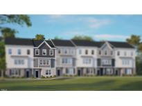 Modern 3-story townhome with gray siding and white accents at 752 Dorset Stream Dr, Fuquay Varina, NC 27526
