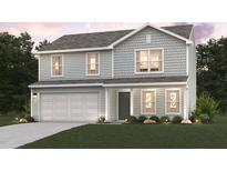 Two-story house with light green siding and a two-car garage at 5767 Waxwing Dr, Snow Camp, NC 27349