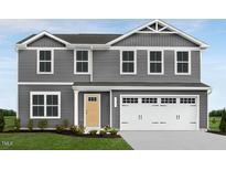 Two-story gray house with white accents and a two-car garage at 1577 Ivy Meadow Ln, Zebulon, NC 27597
