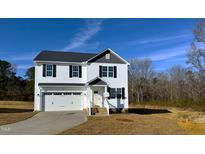 Two-story house with white siding, gray roof, and attached garage at 99 Mapledale Ct, Benson, NC 27504