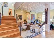 Bright dining area with a modern wooden table and stylish decor at 103 W Main St # 405, Durham, NC 27701