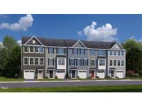 Row of modern townhouses with attached garages at 1218 Helms St, Durham, NC 27713