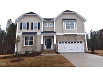 Two-story house with stone accents and a two-car garage at 125 Bold Dr, Youngsville, NC 27596