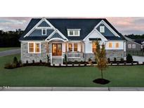 Two-story home with stone and siding exterior at 2865 Silk Hope Gum Springs Rd, Pittsboro, NC 27312