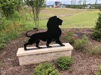 Community entrance with a black metal lion statue on a brick base at 107 Ludbrook Ct, Apex, NC 27523