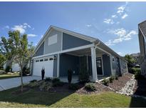 Front view of a two-toned house with a white garage door and landscaping at 177 Swain St, Clayton, NC 27527
