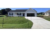 Newly built home with a one car garage and front yard at 138 Lotus Ave, Smithfield, NC 27577