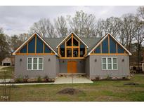 Modern home with gray siding and unique design at 1203 Keith Hills Rd, Lillington, NC 27546