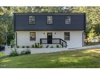 Newly renovated two story home with black and white exterior at 2113 Eveton Ln, Sanford, NC 27330