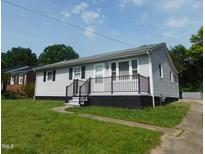 Gray house with black trim and a black metal railing at 413 Columbia Avenue Ave, Burlington, NC 27217