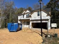 New construction home with gray siding and a two-car garage at 115 Pedestal, Zebulon, NC 27597