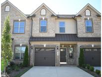 Brick townhouse with a 2-car garage at 1033 Bonanza Ln # 34, Mebane, NC 27302