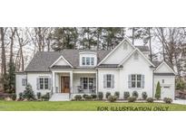 Two-story craftsman style home with white siding and gray roof at 4808 Glen Forest Dr, Raleigh, NC 27612