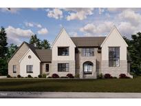 Modern two-story house with stone accents and large windows at 9105 Overlook Crest Dr, Wake Forest, NC 27587