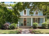 Two-story home with porch and landscaping at 214 College St, Oxford, NC 27565