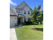Two-story home with front yard and landscaping at 1565 Sage Treee Dr Dr, Zebulon, NC 27597