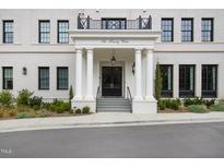 Six Twenty Wade building entrance with columns, double doors, and landscaping at 620 Wade Ave # 301, Raleigh, NC 27605