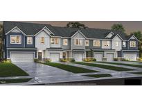 Row of townhomes with attached garages and landscaping at 1341 Bessie Ct, Wake Forest, NC 27587