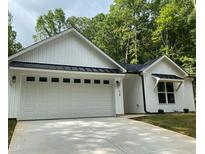Charming single-story home with a two-car garage at 114 Shoshone Dr, Louisburg, NC 27549
