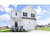Charming two-story home with white siding, black shutters, and a stone-accented entryway at 20 Charlies Bend Way, Spring Lake, NC 28390