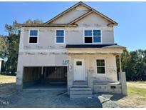 Two-story home under construction with a large front yard at 199 Grand Griffon Way, Lillington, NC 27546