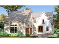 Two-story house with beige siding and brick accents at 3325 Colby Chase Dr # 9, Apex, NC 27539