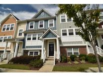 Modern townhouse exterior with attractive facade at 725 Traditions Grande Blvd, Wake Forest, NC 27587