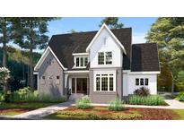Two-story home with gray brick and white accents at 3331 Colby Chase Dr # 8, Apex, NC 27539