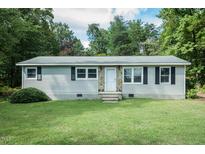 Ranch style home with stone accents and lawn at 683 Baynes Rd, Burlington, NC 27217