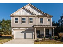 Two-story home with gray siding and white trim at 480 Suhani Ln, Clayton, NC 27520