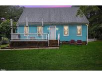 Blue house with deck, steps, and lawn at 229 Turnipseed Rd, Wendell, NC 27591