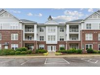 Brick building exterior with parking and landscaping at 215 Eyam Hall Ln, Apex, NC 27502