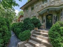 Stone house with a charming front entrance and steps at 2501 Kenmore Dr, Raleigh, NC 27608