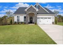 Two-story house with stone accents and two-car garage at 11 Claude Creek Dr, Smithfield, NC 27577