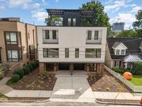 Modern two-unit building with rooftop decks and attached garages at 515 W Lenoir St # 101, Raleigh, NC 27601