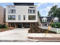 Modern two-unit building with sleek design and double garages at 515 W Lenoir St # 102, Raleigh, NC 27601