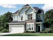 Stunning two-story home with stone and siding exterior at 7711 Litcham Dr, Raleigh, NC 27615